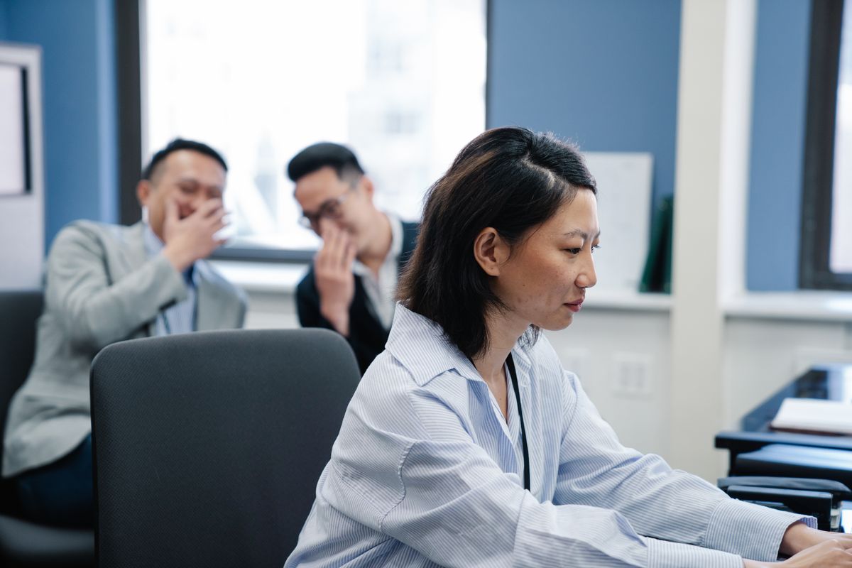 Colleagues reviewing work together